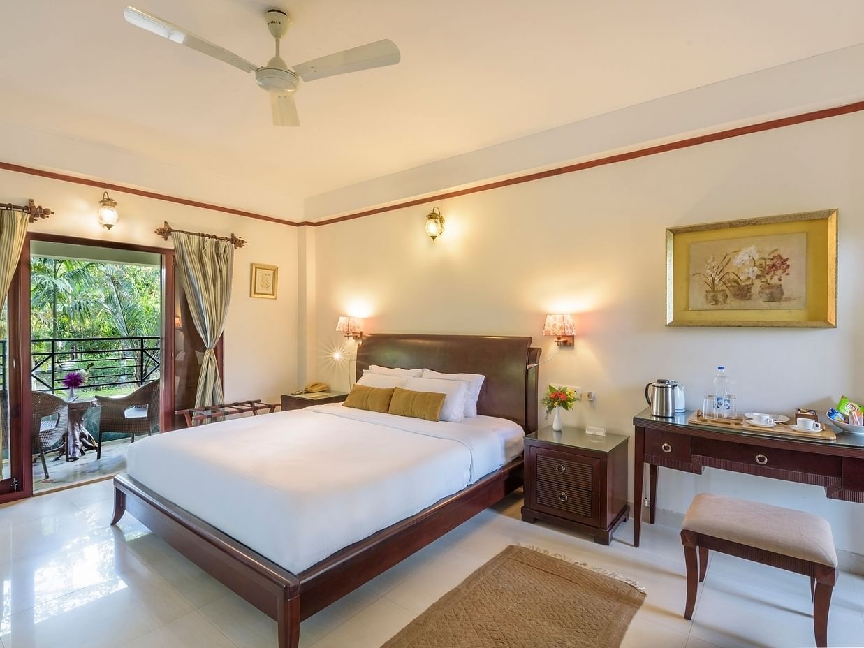 A view of Premium Double room featuring a comfy bed overlooking the green surroundings at The Riverwood Forest Retreat, Dooars