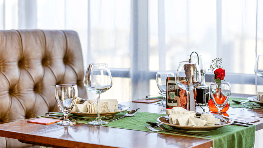 An overview of the sofa seating with a table in the centre having many items on it inside FOGO NO CHÃO restaurant - Ramada by Wyndham Addis, Addis Ababa