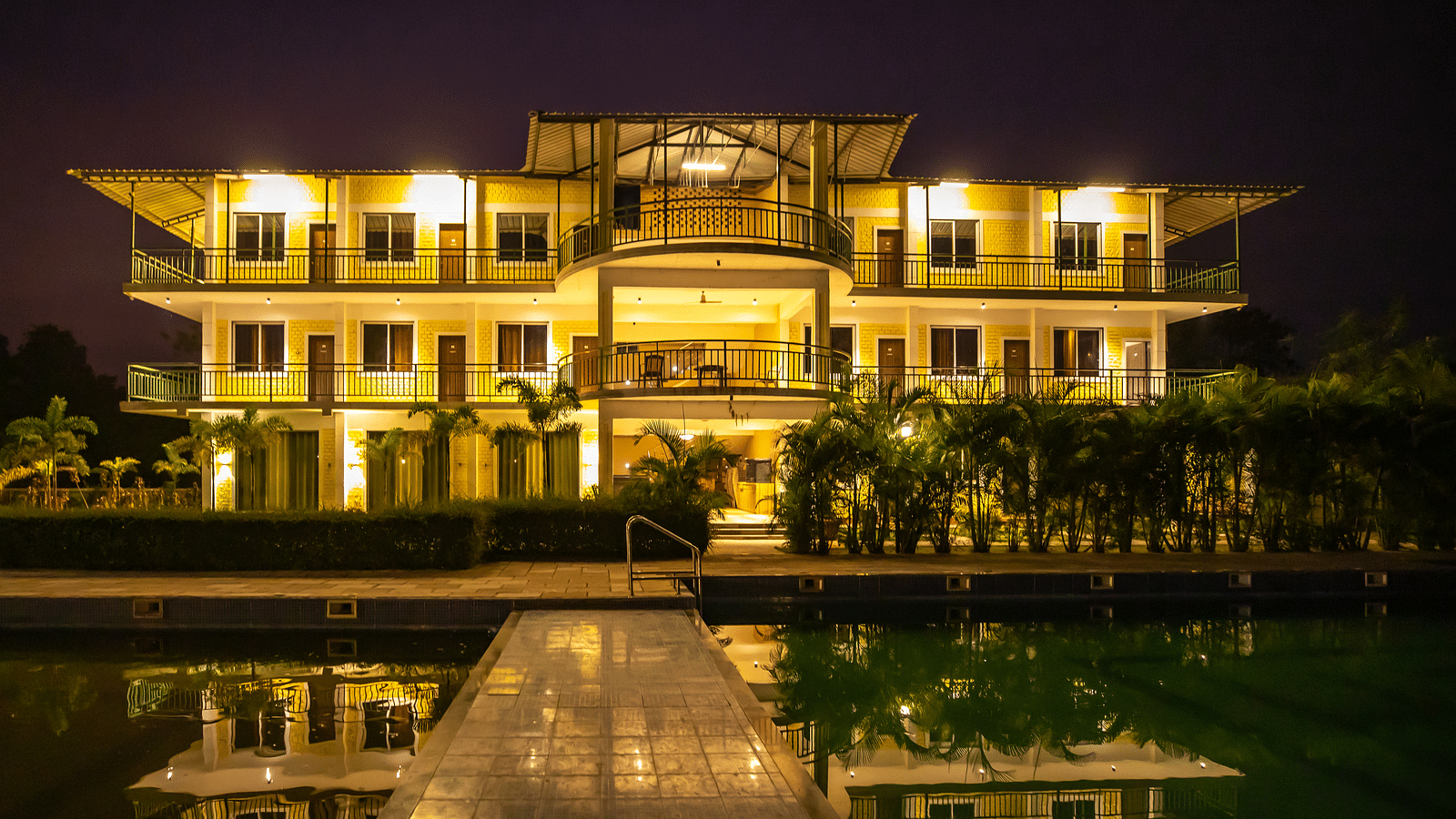 Facade of The Kanila Resort with a swimming pool taken during the night.