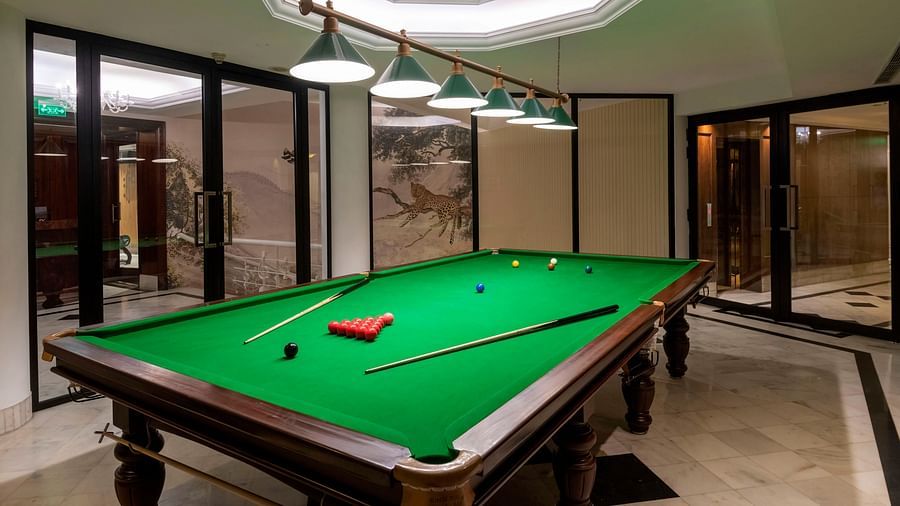 image of a snooker table in a room at The Claridges New Delhi