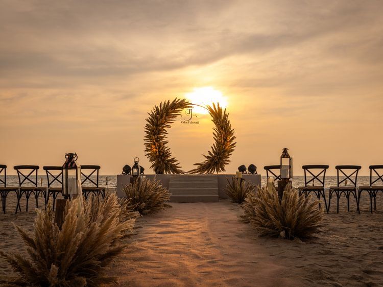 Romantic sunset backdrop for a wedding at Heritage Village Resorts & Spa, Goa.