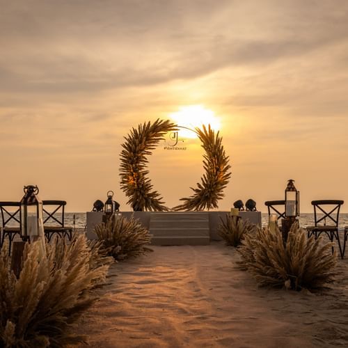 Romantic sunset backdrop for a wedding at Heritage Village Resorts & Spa, Goa.