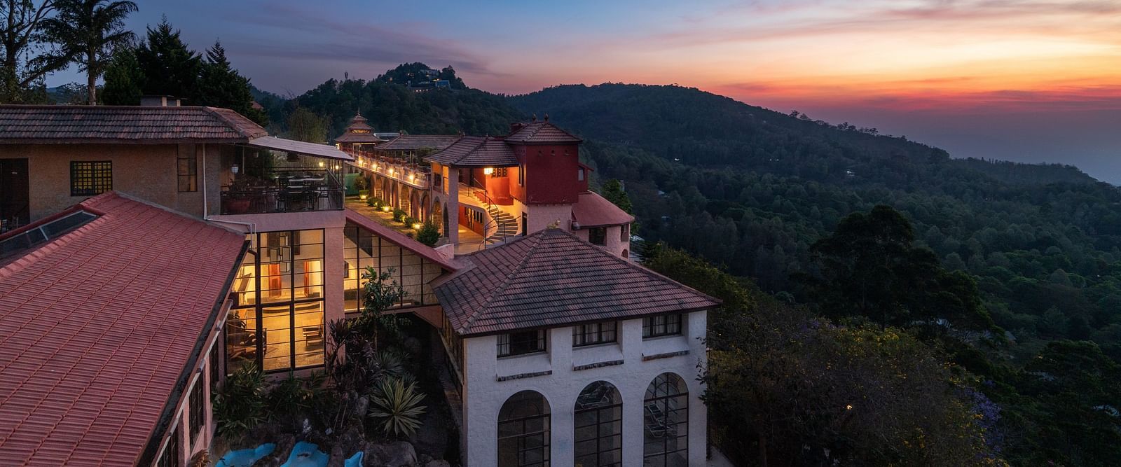 An evening view of a property which has many villas | Mango Hill, Yercaud