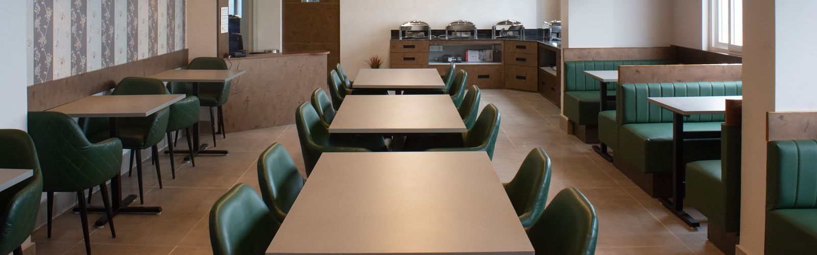 Dining space with tables and chair at Avianna Soma