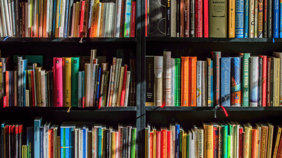 books in black wooden book shelf
