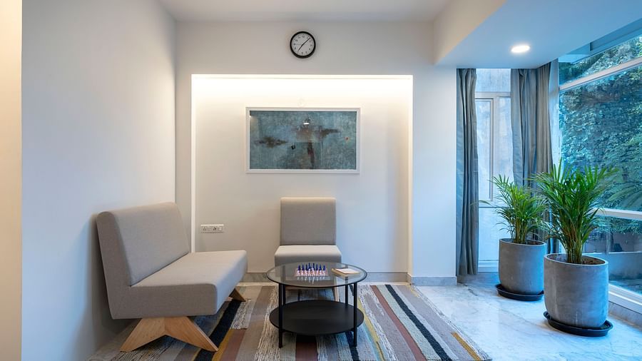 Cosy corner with sofa and round table in  Studio Twin Room at Nest by Rivido Apart Hotel, Bannerghatta Road