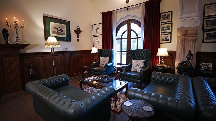 A vintage-style lounge area with elegant leather sofas and decor - Khas Bagh, Jaipur.