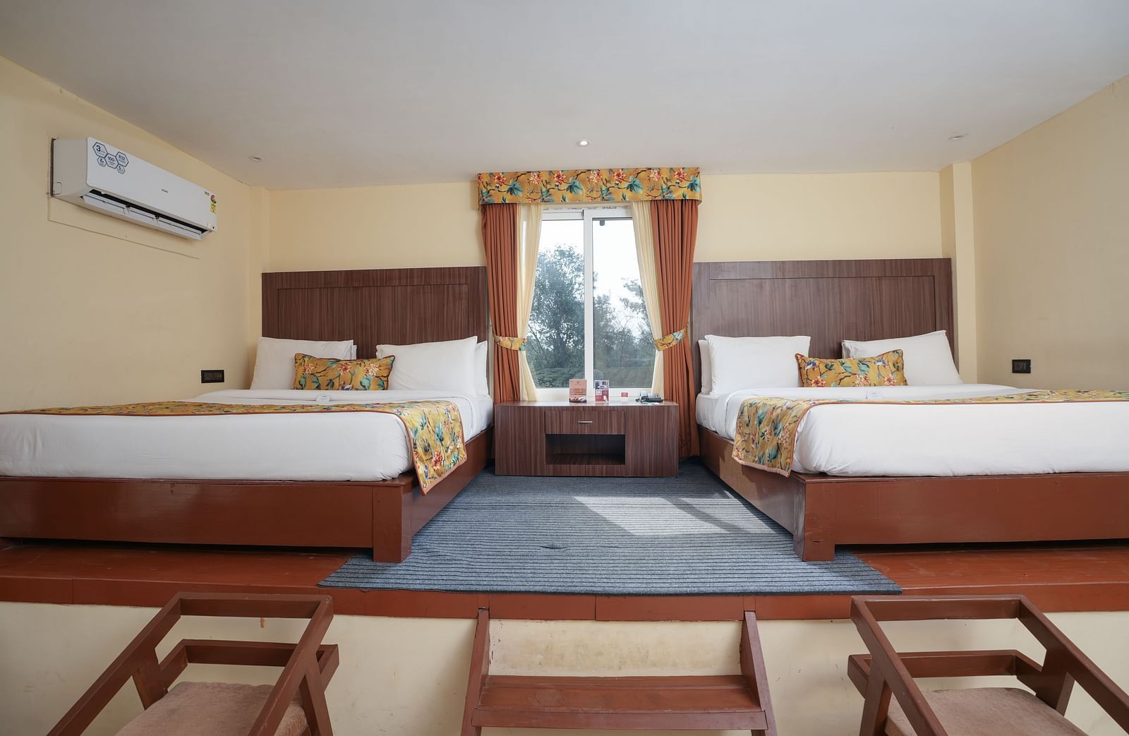 Family room with two large beds at Summit Green Lake Tea Resort & Spa, Kaziranga