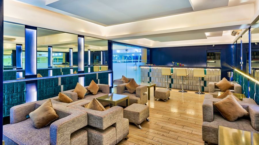A modern hotel lobby with blue and white seating and a contemporary design | Grand Bay Resort and Spa | Grande Bay Resort & Spa, Mamallapuram