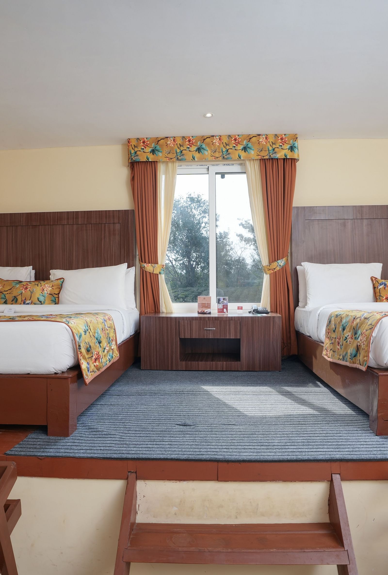 Family room with two large beds at Summit Green Lake Tea Resort & Spa, Kaziranga