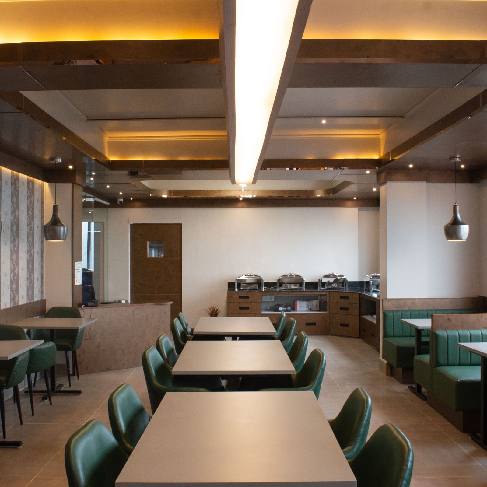 Dining space with tables and chair at Avianna Soma