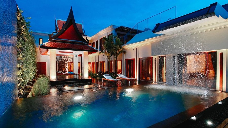 facade image featuring the swimming pool with under water lighting - two bedroom private pool villa