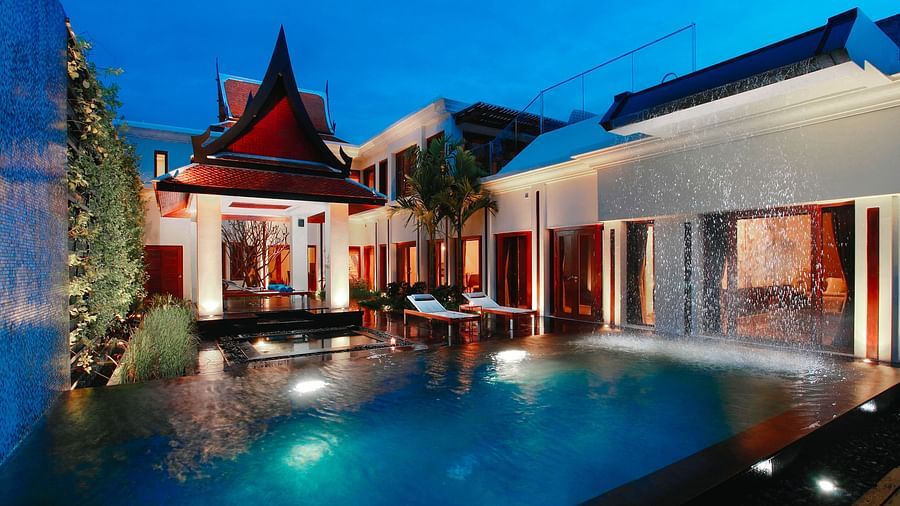 facade image featuring the swimming pool with under water lighting - two bedroom private pool villa