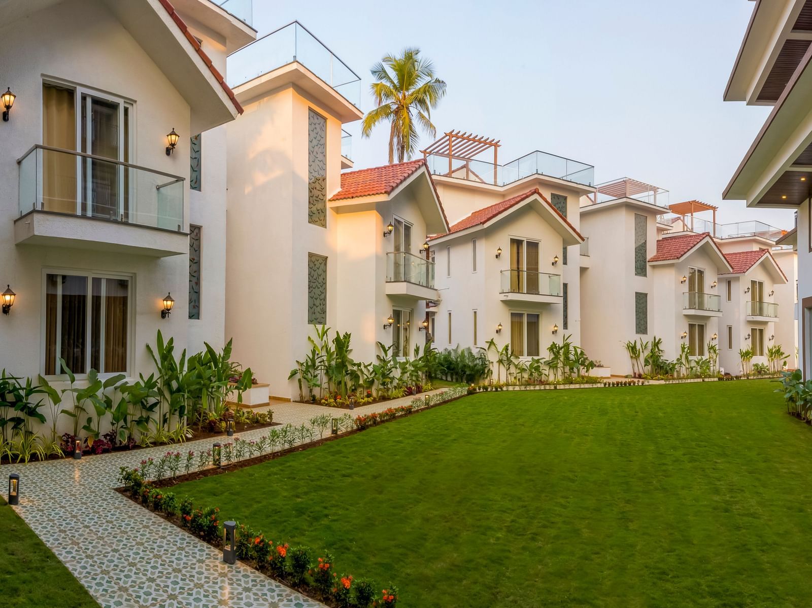 Rooms view with a manicured garden in front of it - The Tanisi Hotels & Resorts, Goa