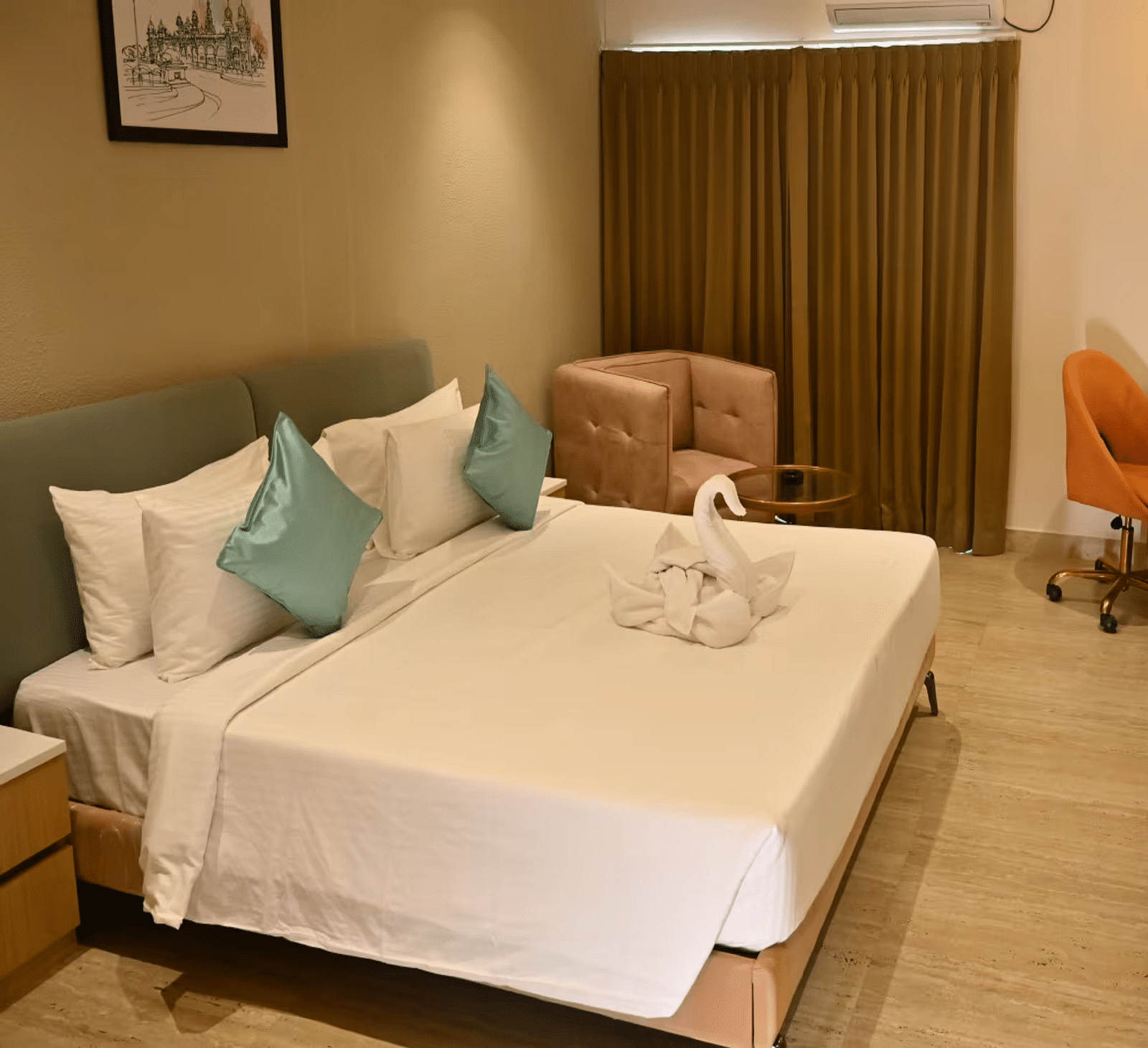 Spacious premium room with a comfy bed, a cosy seating area, and a work desk with a chair - Livancia Hillside
