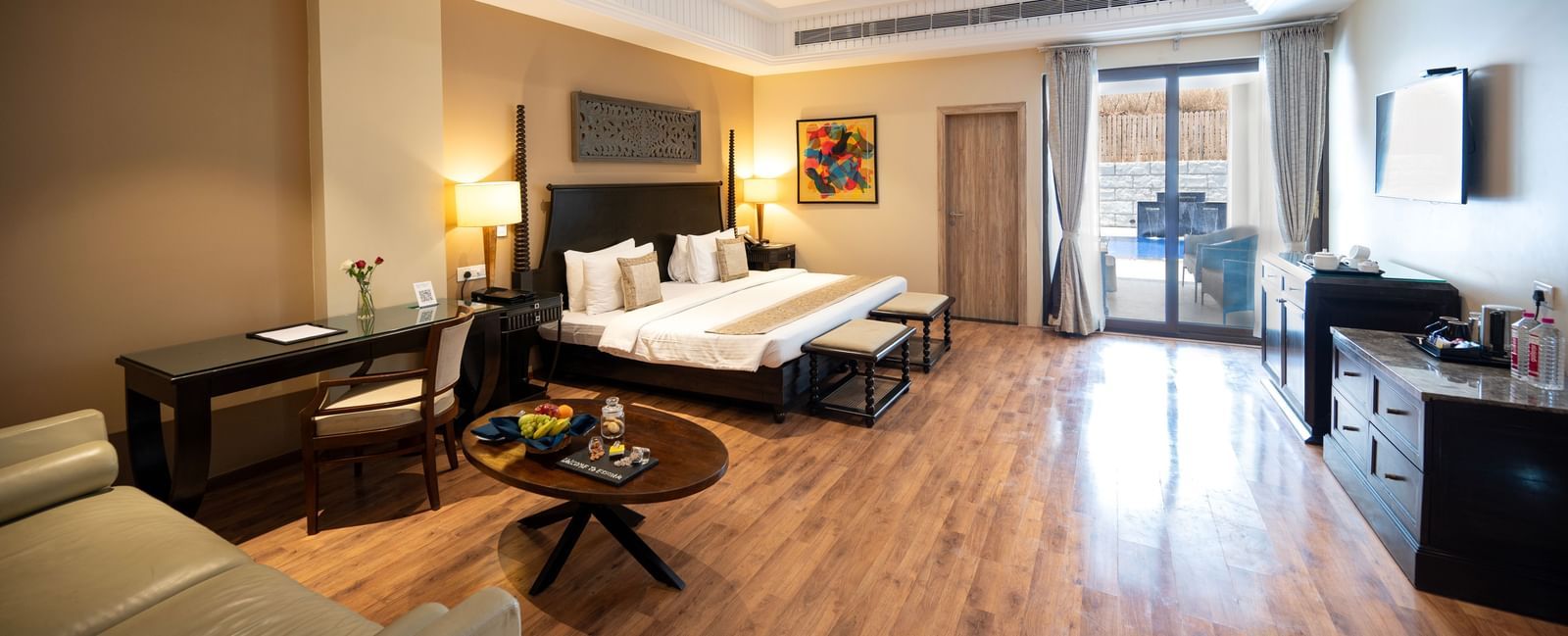 Presidential suite bedroom at Essentia Luxury Resort & Spa, Udaipur, with a spacious layout, modern room amenities, and a balcony
