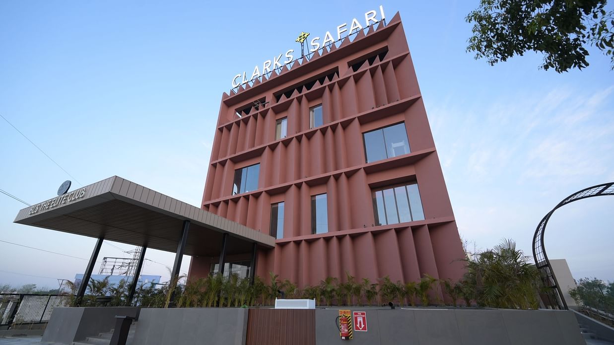 Facade of Clarks Safari Haridwar with a geometric canopy structure at its entrance.