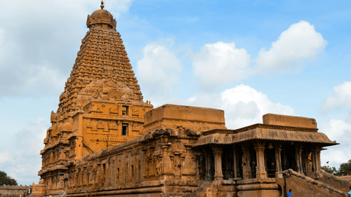 image of the Brihadeeswarar Temple in Thanjavur with a bright blue sky in the background