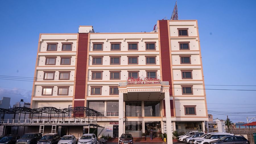 The view of Clarks Collection Somnath with facade, parked vehicles, and clear skies above the property.
