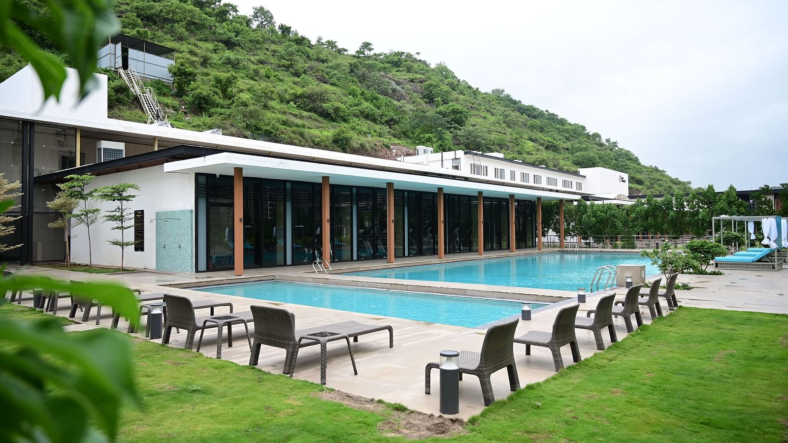 swimming pool at club charholi after the green lawn
