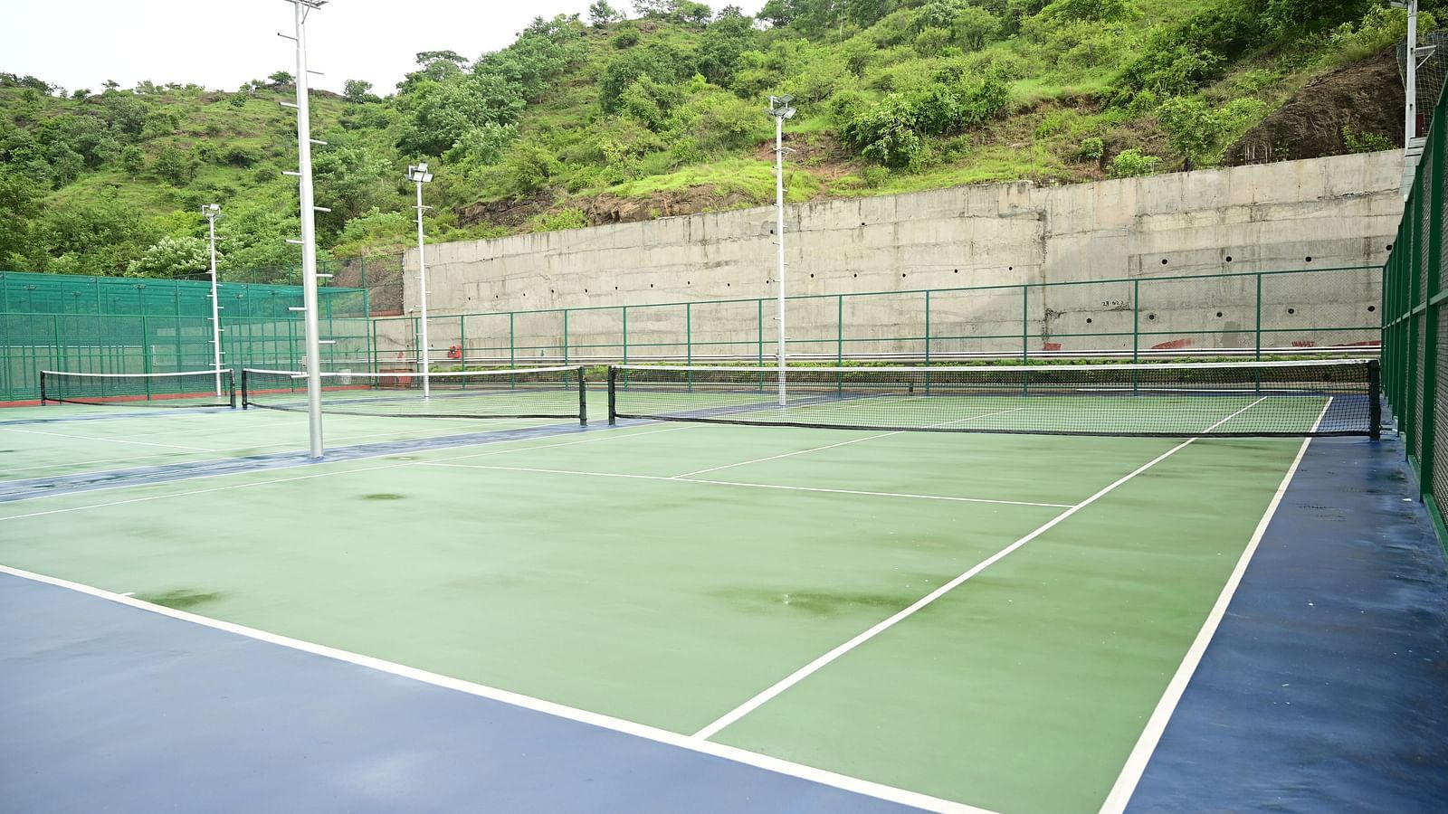 image of the tennis court from the corner at club charholi, pune