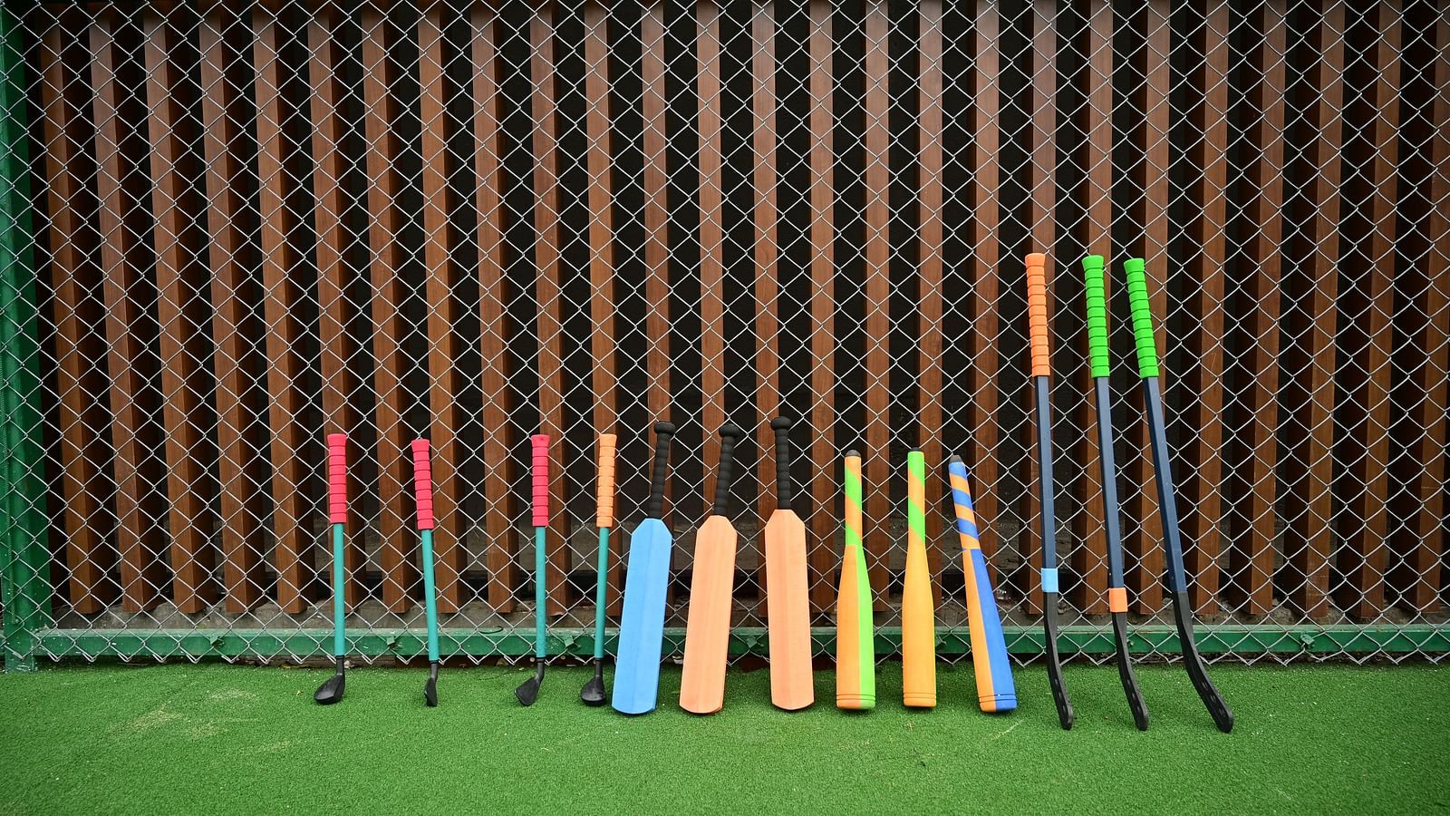 various sports equipment for kids stood up against the wall at club charholi, pune