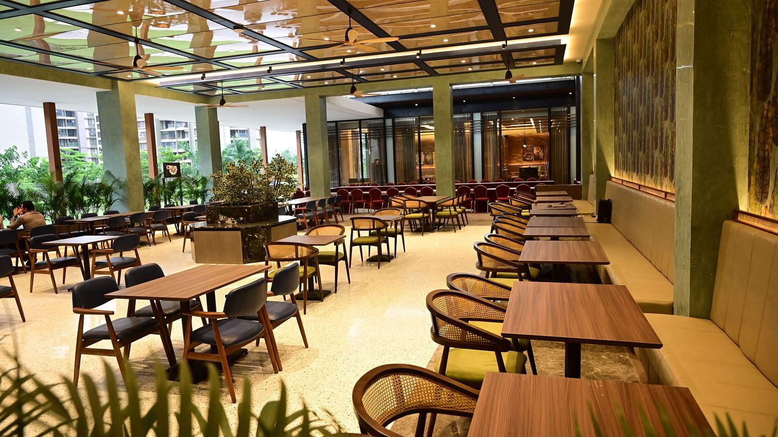 image of the dining area of Citrus Restaurant and cafe at club charholi, pune