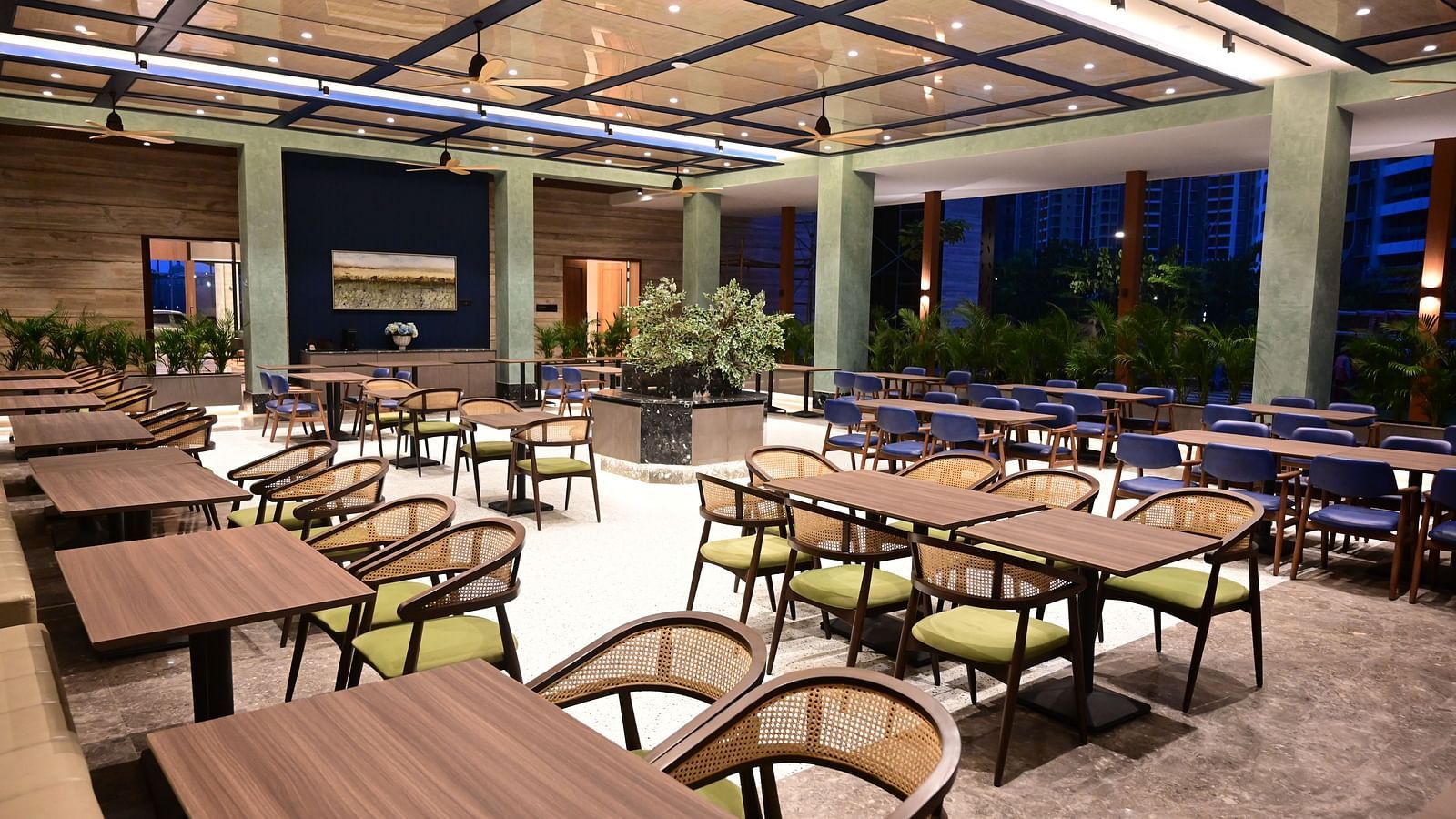 close up images of the tables at citrus restaurant and cafe at club charholi, pune at late evening
