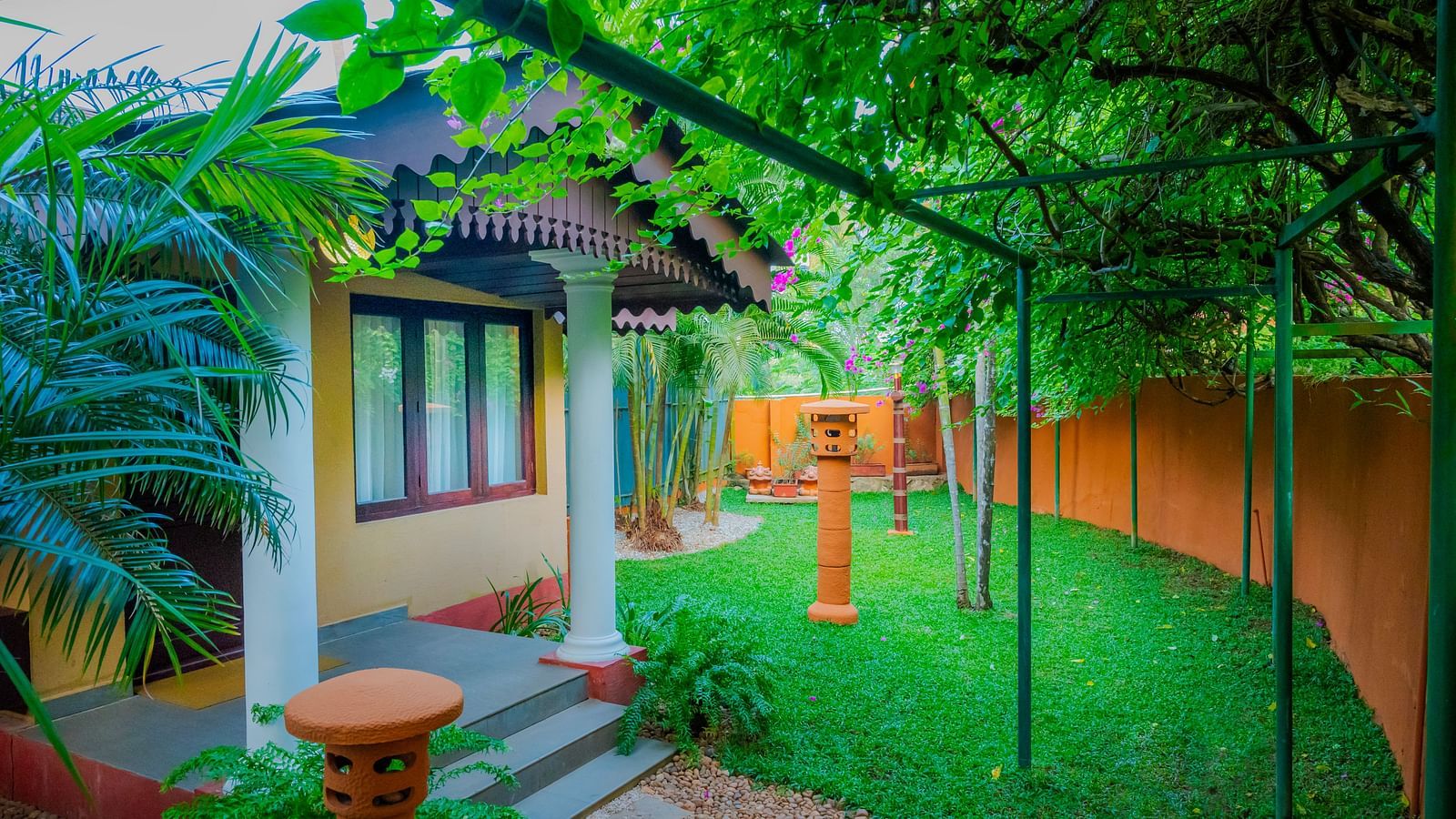 Cottage with a private garden and outdoor seating at a resort.