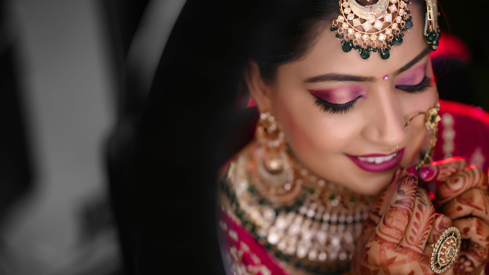 a woman in bridal makeup wearing her nose ring