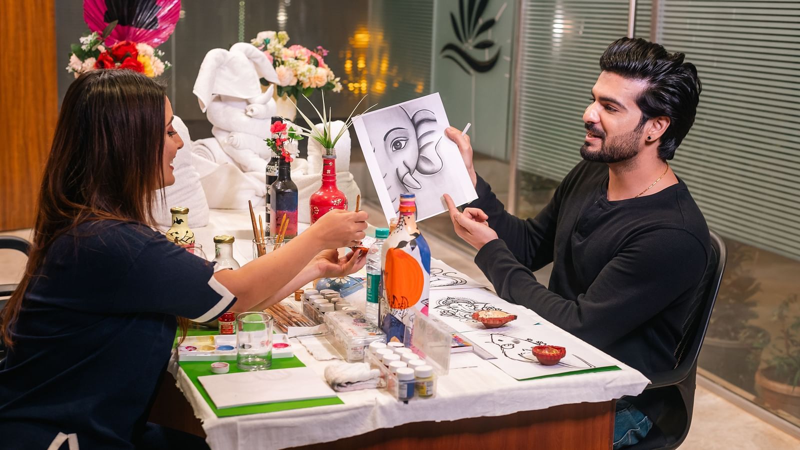  Couple enjoying a painting session as part of creative activities at The Grand Legacy Resort and Spa.