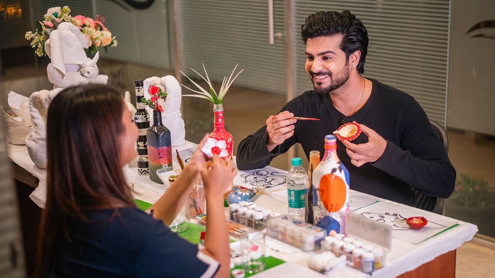  Guests engaged in a hands-on craft activity at The Grand Legacy Resort and Spa.