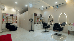 Overview of the Salon with chairs and mirrors in view - VITS Satyajeet Karad