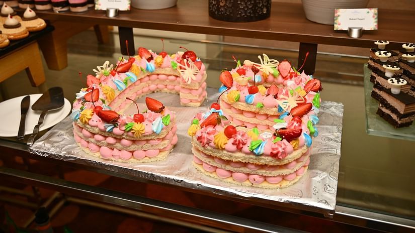 A picture featuring a decorated cake placed on the table