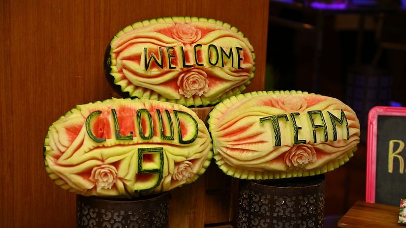 Picture featuring 3 watermelons with carved text welcome cloud 9 team