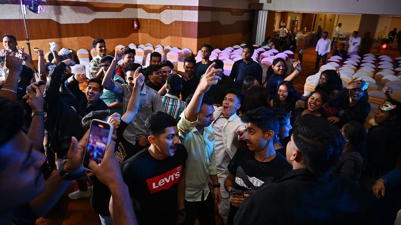 A group of people dancing inside a hall