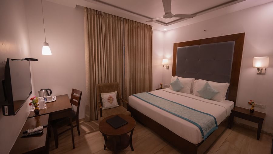 Clarks Collection Bhavnagar bedroom with desk, chair, and lamp.