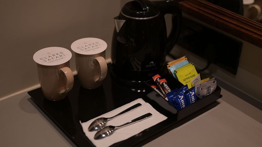 Tea and Coffee Maker placed on a counter in Deluxe Room. - Clarks Safari Haridwar