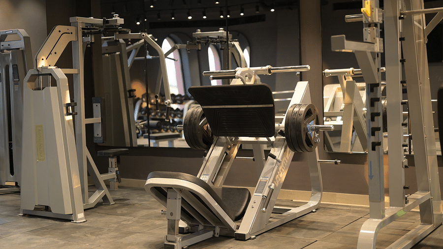Various weight training machines arranged in a gym setting. - Clarks Safari Haridwar