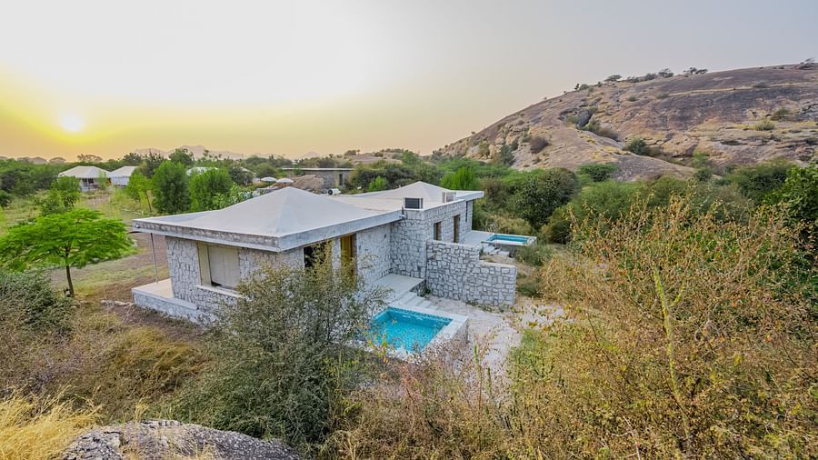 Private villa with a pool nestled in the rocky landscape at Clarks Safari, Jawai.