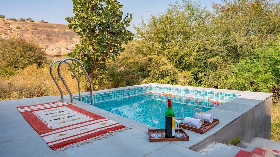 Private plunge pool with sun loungers overlooking the forest at Clarks Safari, Jawai.