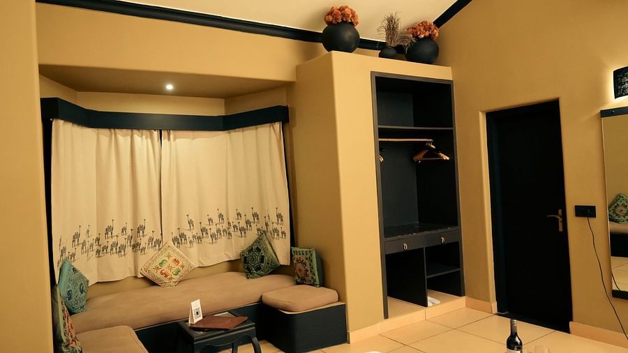 A cosy sitting space for five with a centre table in the Superior Cottage at Clarks Safari, Pushkar