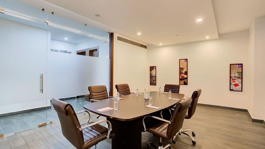 Bright and minimal meeting room designed for corporate discussions and business presentations at Voyage Milestone Hotel and Banquet Siliguri
