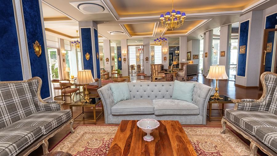 Another angle of  the ambiently-lit club house with comfortable furniture for people to sit and relax on - The Manor Luxury Hotel, Shimla