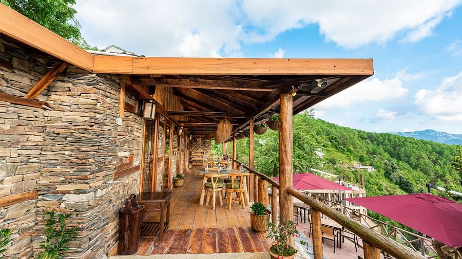A balcony view of the Mario restaurant with the serene valley in the background - The Luxury Hotels, Shimla