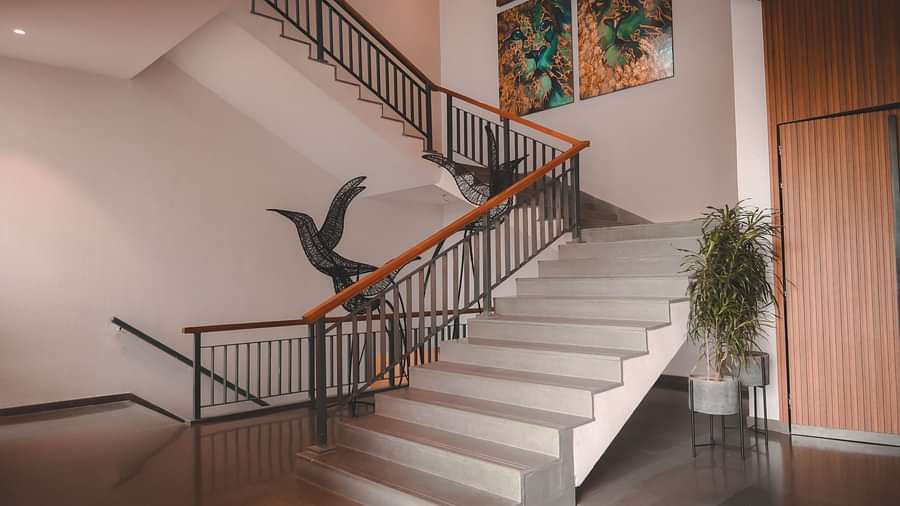 The staircase at Singalila Club with wooden panelling on the sides