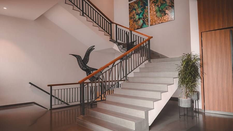 The staircase at Singalila Club with wooden panelling on the sides