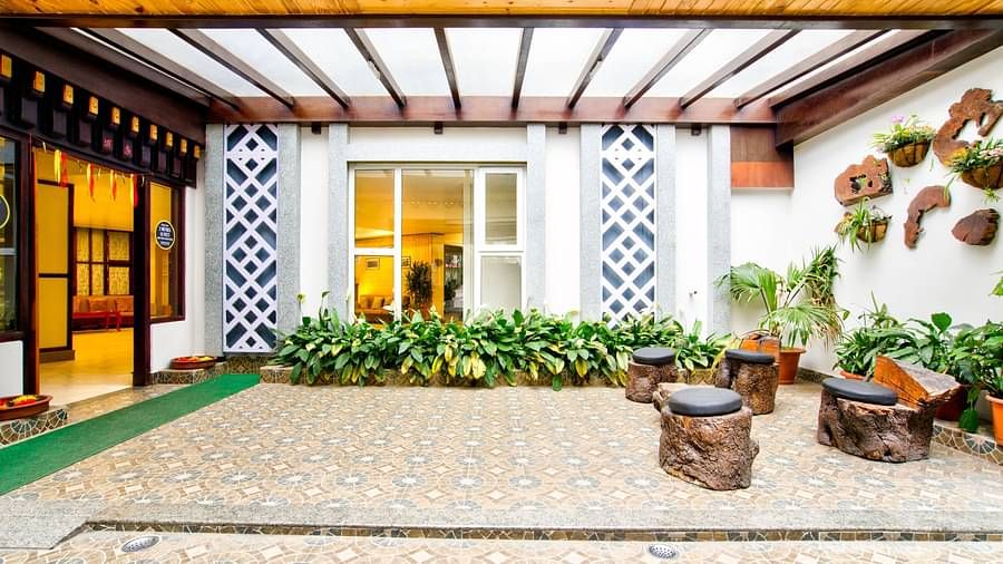 Exterior view with plants at Summit Ttakshang Residency Hotel & Spa, Gangtok