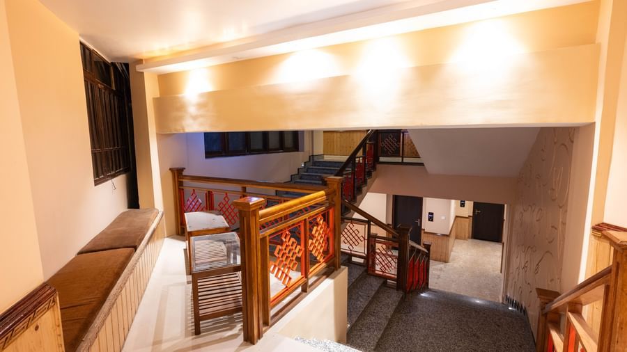 An entrance of a staircase adorned with illuminating lights at Avianna Hungry Jack, Gangtok.