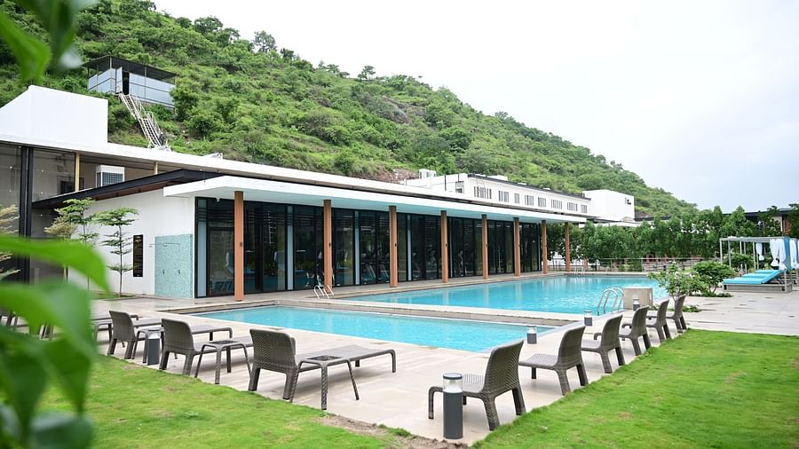 swimming pool at club charholi after the green lawn